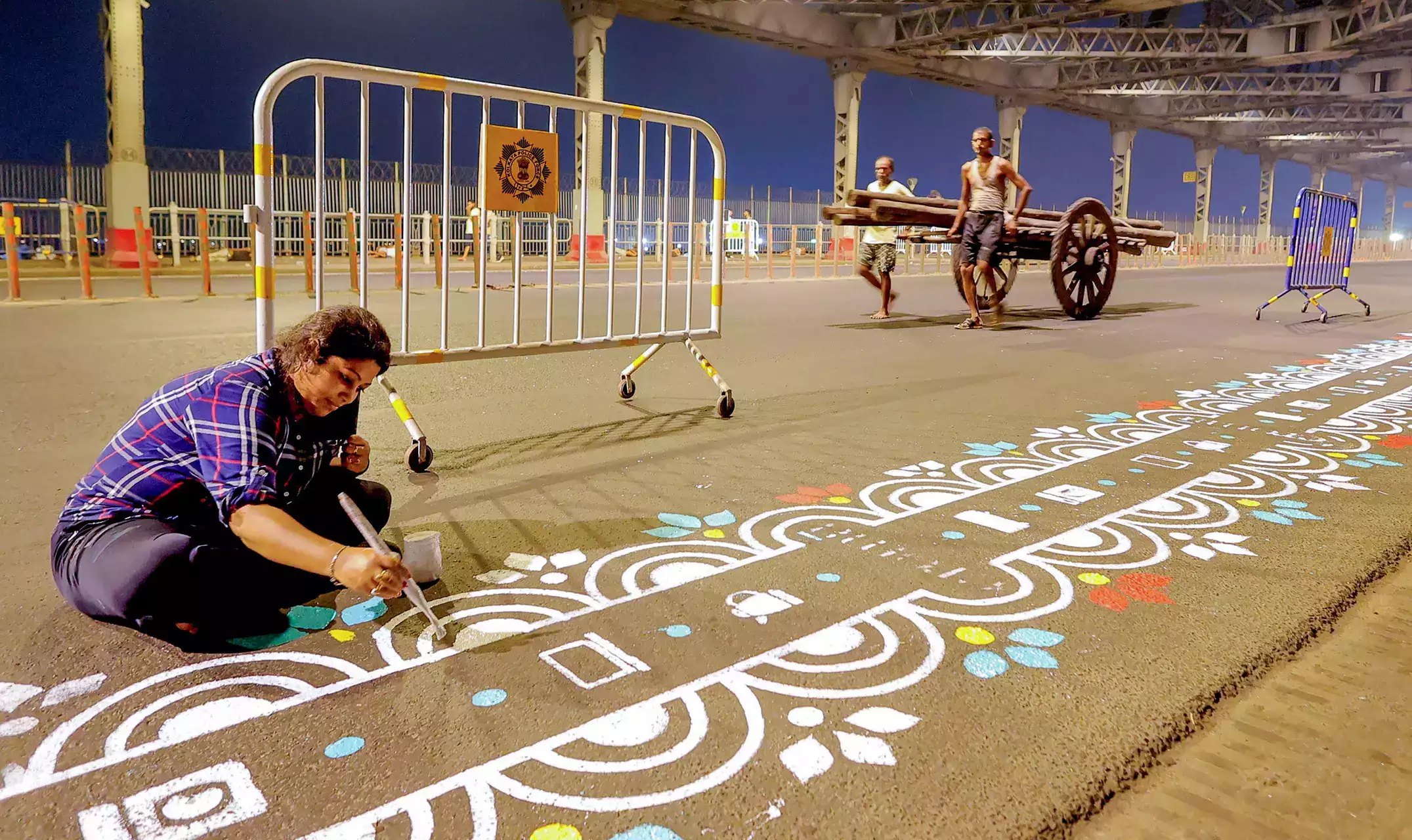 ‘Kolkata’s Howrah Bridge adorned with vibrant ‘alpana’ art in anticipation of Durga Puja